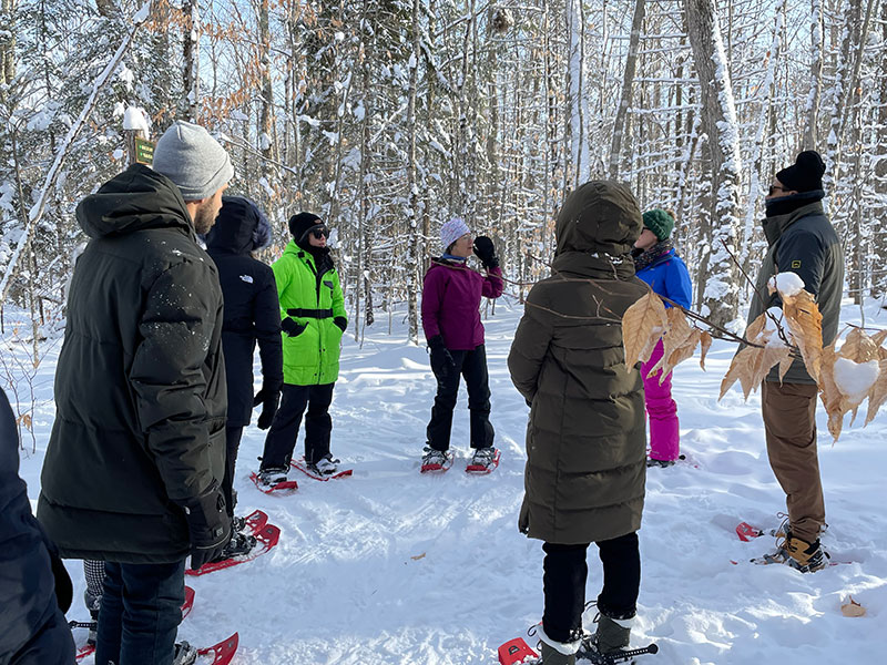 Group of people snowshoeing in the Adironacks
